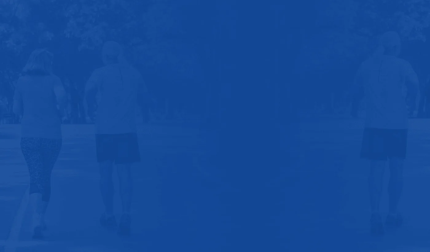 Deep blue section backdrop from the manufacturer's page showing two people walking outdoors