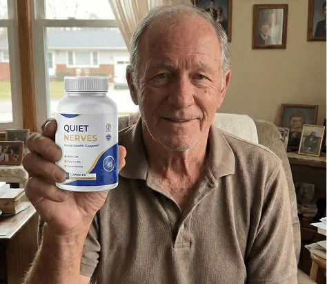 Long-term Quiet Nerves user holding the nerve health support bottle at home